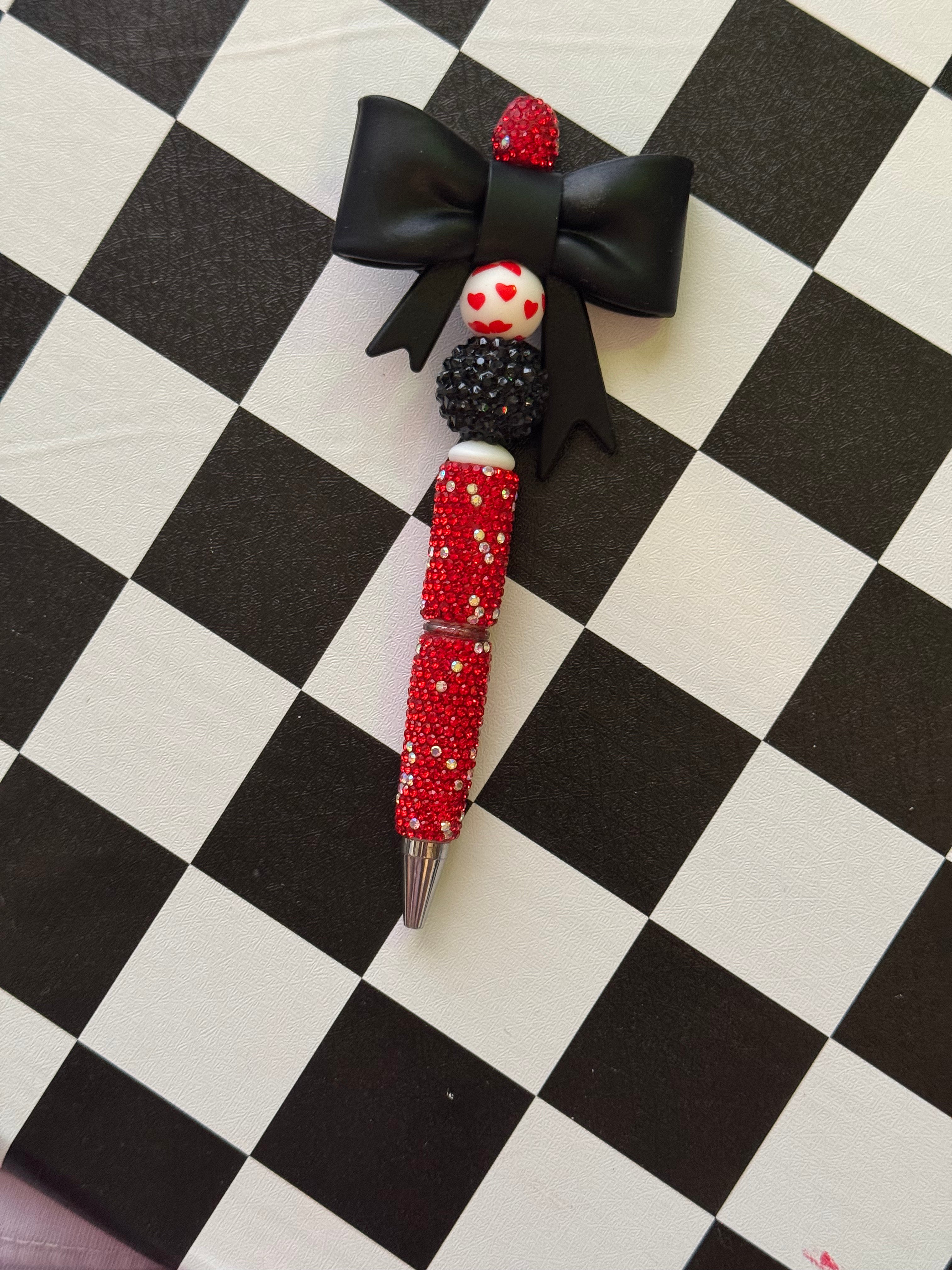 Beaded red hearts and black bow pen